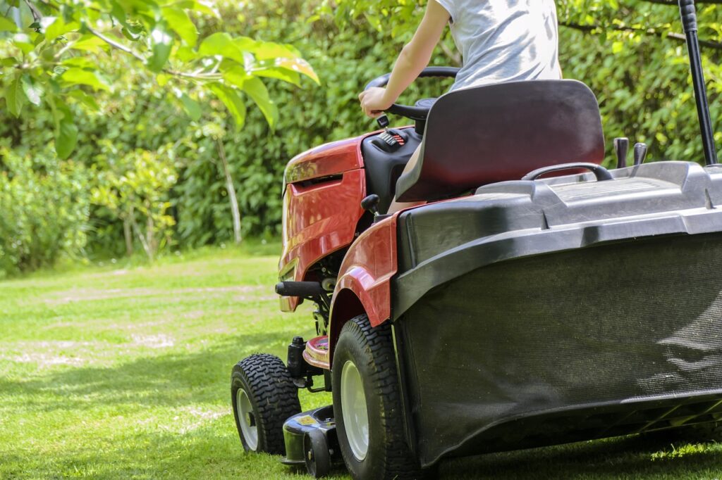 mowing the grass, gardening, lawn, garden, nature, care, lawnmower, tractor, woman mowing, green, summer, relaxation, automation, machine, garden accessories, hobby, grass